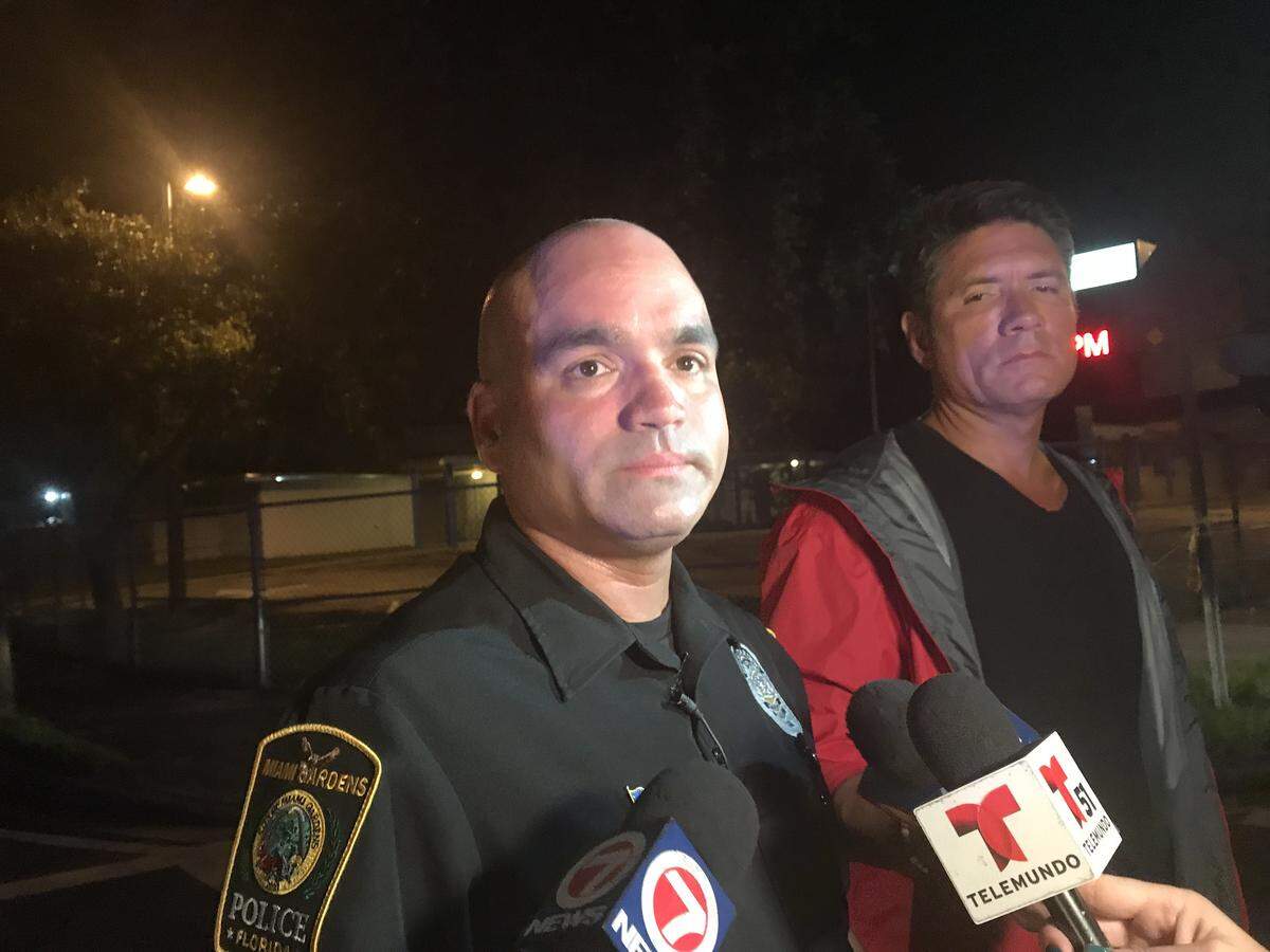 Carlos Austin, a spokesman for Miami Gardens police, briefs the media on the shooting Monday night in Miami Gardens.