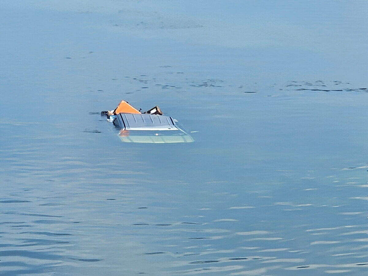 A Chevrolet pickup truck sinks in the Harris Gap Channel in the Florida Keys on Saturday, July 4, 2026.
