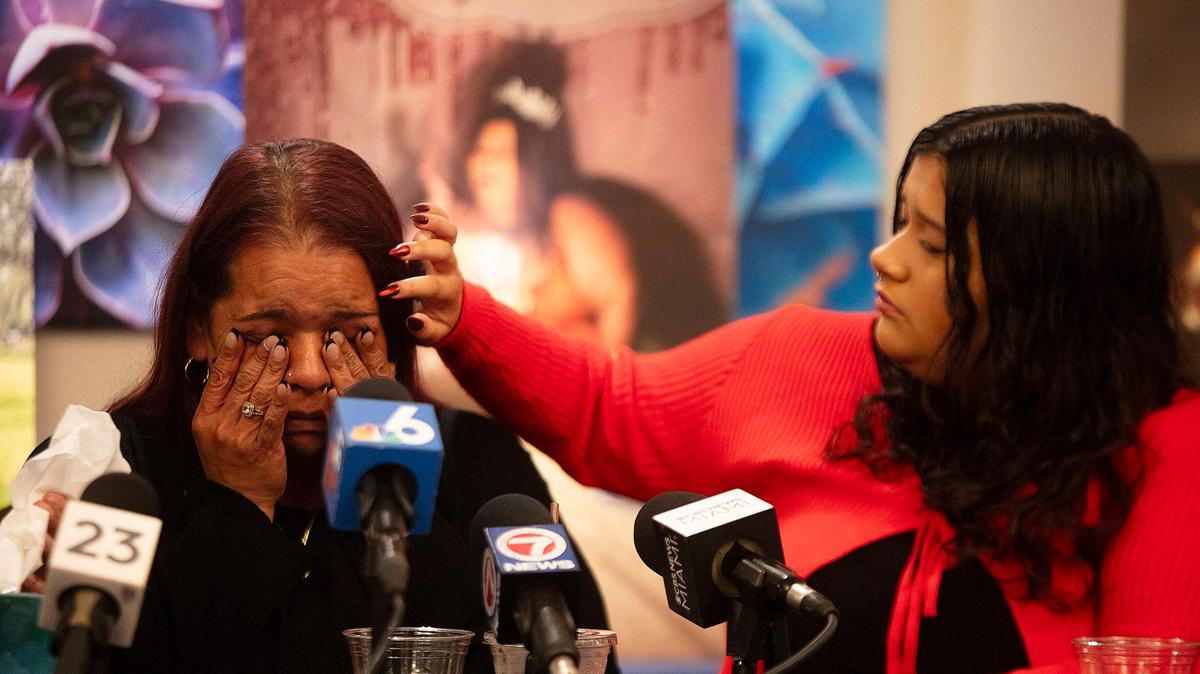 Kristy Garcia (left), mother of Evelyn Valdes, wipes away tears as Jocelyn Valdes (right), Evelyn’s sister, consoles her during a press conference at the Marriott Dadeland in South Miami on Thursday, July 24, 2025. The Valdes family issued a plea for witnesses to come forward and shared an update following the loss of Evelyn, who was killed by stray gunfire during a police-involved shooting in Wynwood on June 14.