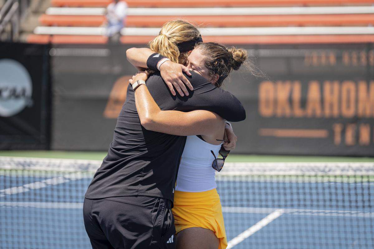 University of Miami tennis star Alexa Noel hugs Hurricanes coach Paige Yaroshuk-Tews after winning the NCAA women’s singles title on Saturday in Stillwater, Oklahoma.
