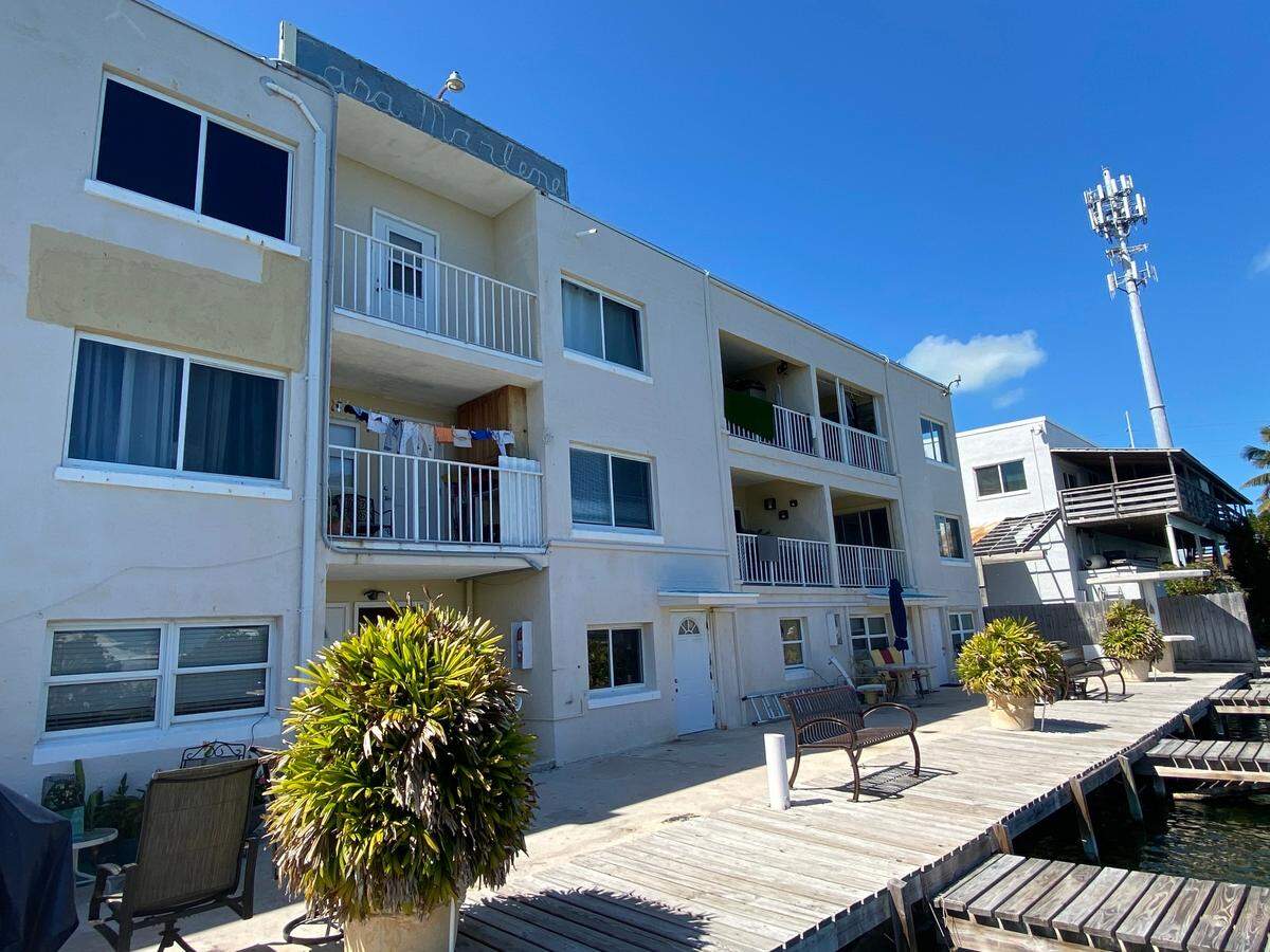 Laundry dries from clotheslines strung on balconies in the back of Mariner Place apartments in the Middle Florida Keys city of Marathon Wednesday, Feb. 23, 2022.
