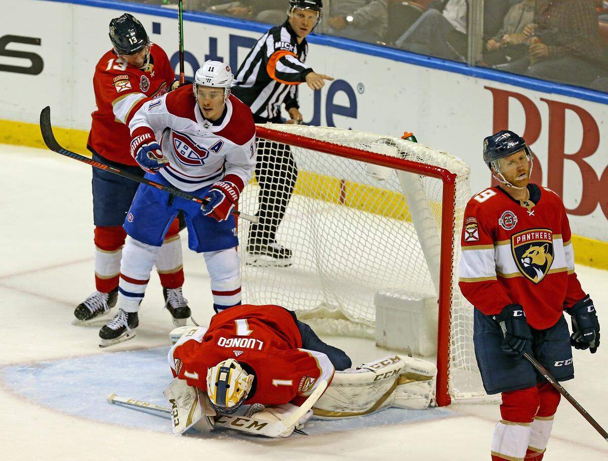 Florida Panthers goalie Roberto Luongo (1) lays on the ice after Montreal Canadiens Tomas Tatar (90) scores the winning goal in the third period Friday, Dec. 28, 2018, at the B&T Center in Sunrise, Fla.