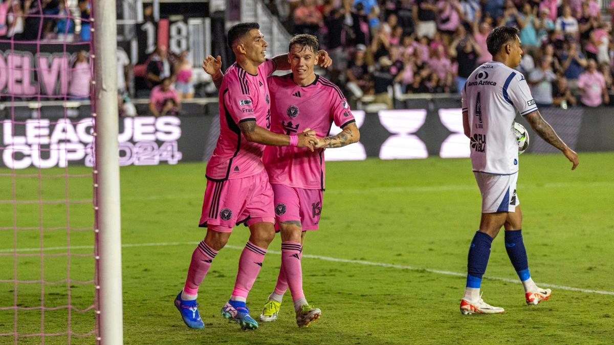 Inter Miami forward Luis Suárez (9) celebrates scoring a goal with teammate Robert Taylor (16) as Puebla midfielder Efraín Zavala (4) walks away during a Leagues Cup match at Chase Stadium on Saturday, July 27, 2024, in Fort Lauderdale, Fla.