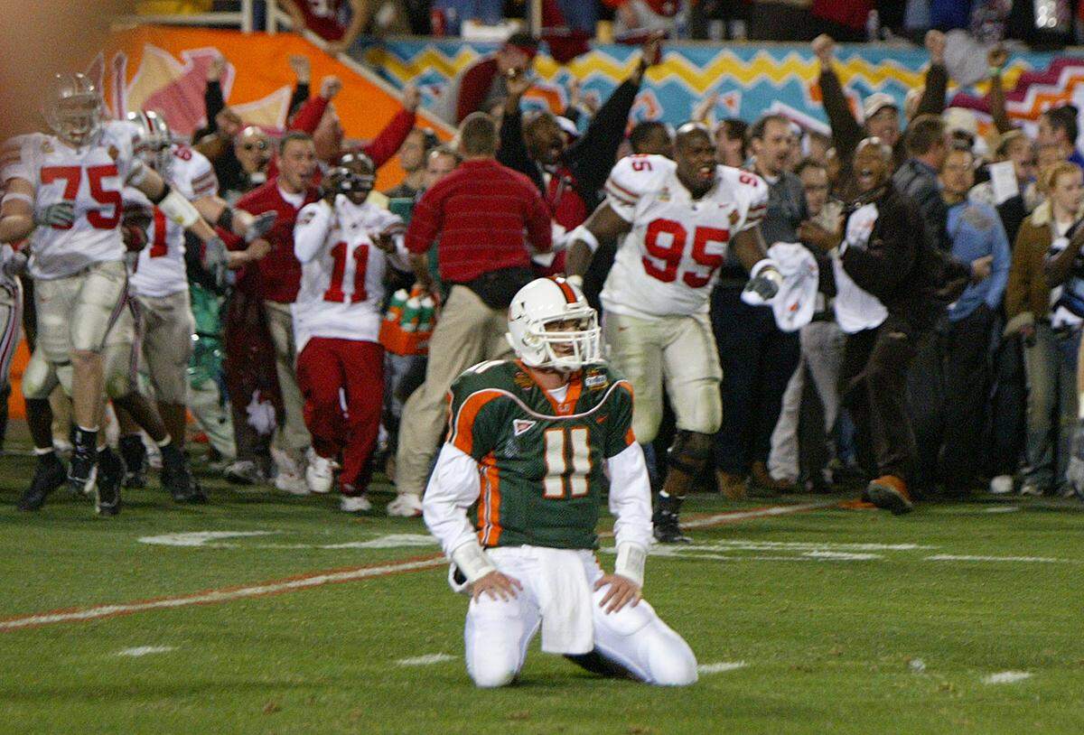 Ken Dorsey sits on the field after losing the National Championship to the Ohio State Buckeyes on Jan. 3, 2003, in the Tostitos Fiesta Bowl National Championship at the Sun Bowl in Tempe, Arizona.