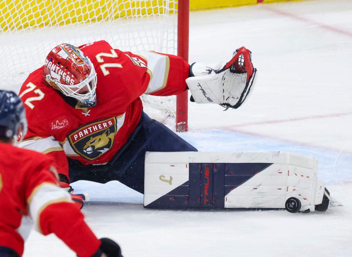 Florida Panthers goaltender Sergei Bobrovsky (72) blocks a shot on goal by New York Rangers center Matt Rempe (73) during the second period of a game on Monday, April 14, 2025, at Amerant Bank Arena in Sunrise, Fla.