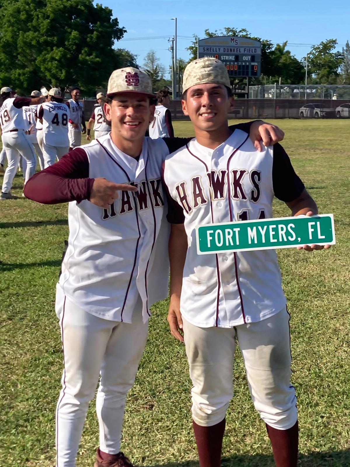Euphoric Miami Springs players Austin Argote (left) and Jordany Gonzalez know where they’re headed as they hold up the Fort Myers street sign following Springs’ 5-0 win over St. Brendan to clinch the Region 4-3A title.