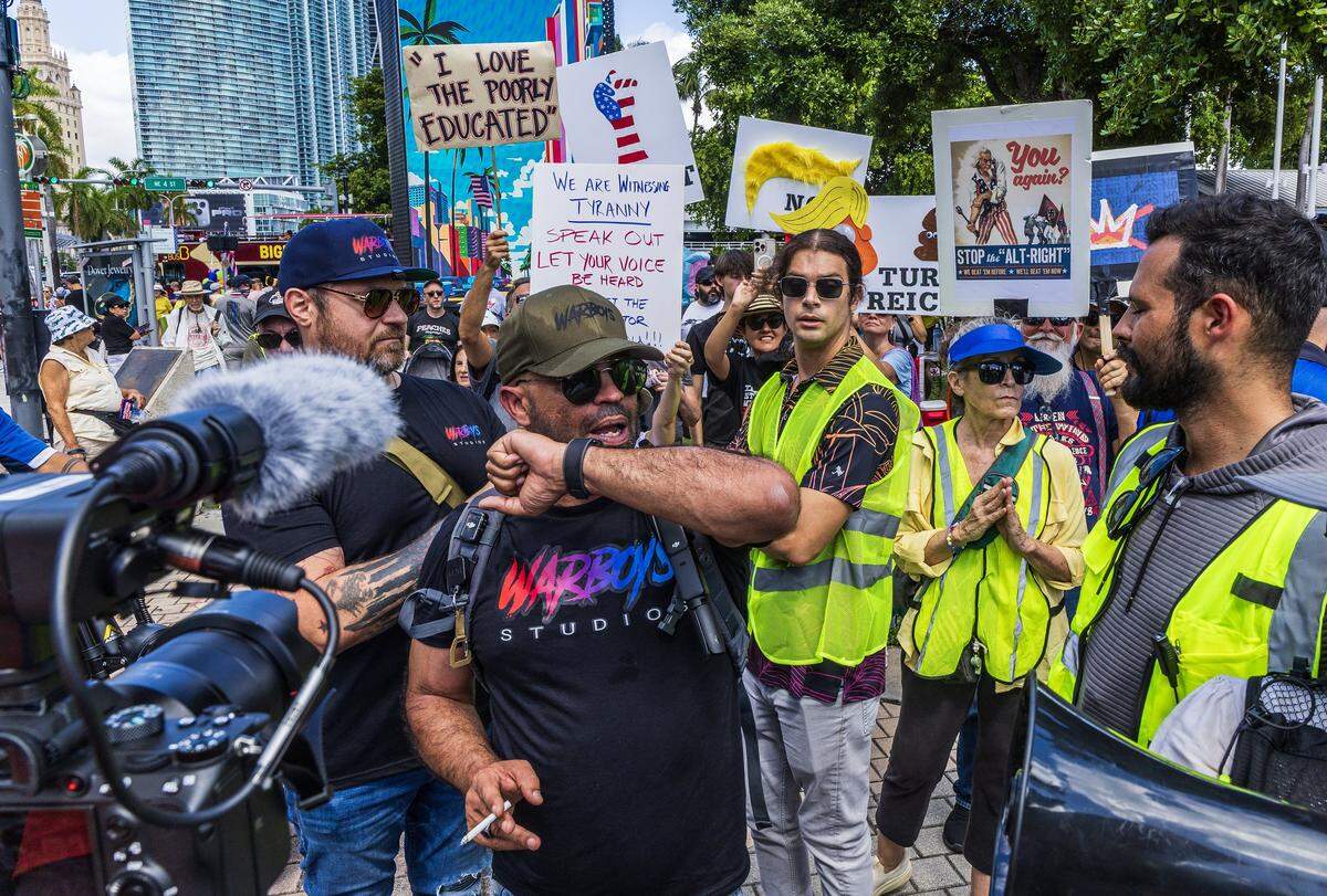  Enrique Tarrio (center) as he walked among protesters at the second ‘No Kings’ protest in Miami. 