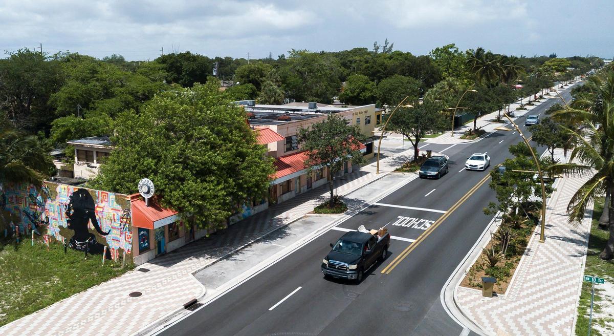 Cars make their way down Sistrunk Boulevard near Cone Plaza on Tuesday, July 2, 2024, in Fort Lauderdale, Florida. The building, which belonged to the late William J. Cone, is scheduled for demolition after the building caught fire.