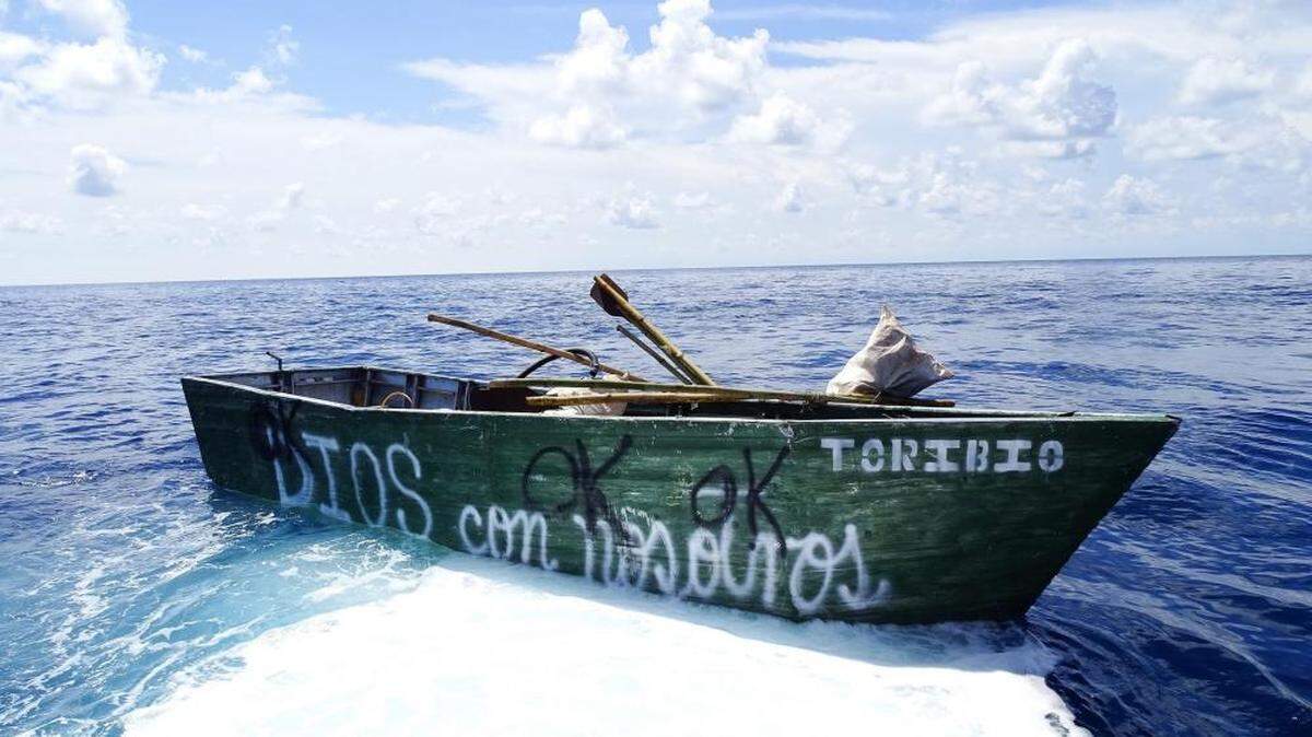 A Cuban migrant boat with ‘Dios con nosotros,’ or ‘God is with us,” floats about 45 miles south of the Marquesas Keys Tuesday, Sept. 13, 2022.