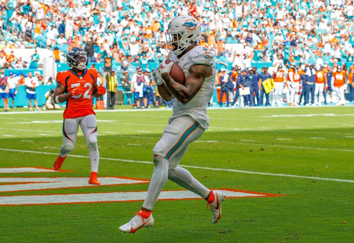 Miami Dolphins running back Raheem Mostert (31) scores a touchdown against the Denver Broncos during third quarter of an NFL football game at Hard Rock Stadium on Sunday, Sept. 24, 2023 in Miami Gardens, Fl.