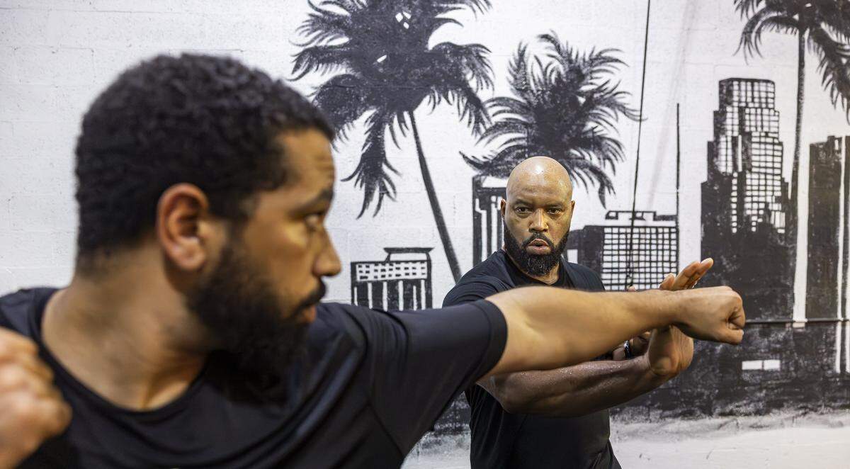 Jalen Dominguez, 26, left, and Chris Henderson, 48, run drills during a training session at their gym on Tuesday, Aug. 12, 2025, in Miami, Fla. Miami Action Design is the first stunt gym in Miami-Dade County and offers classes that teach members how to become stunt performers for movies and television.