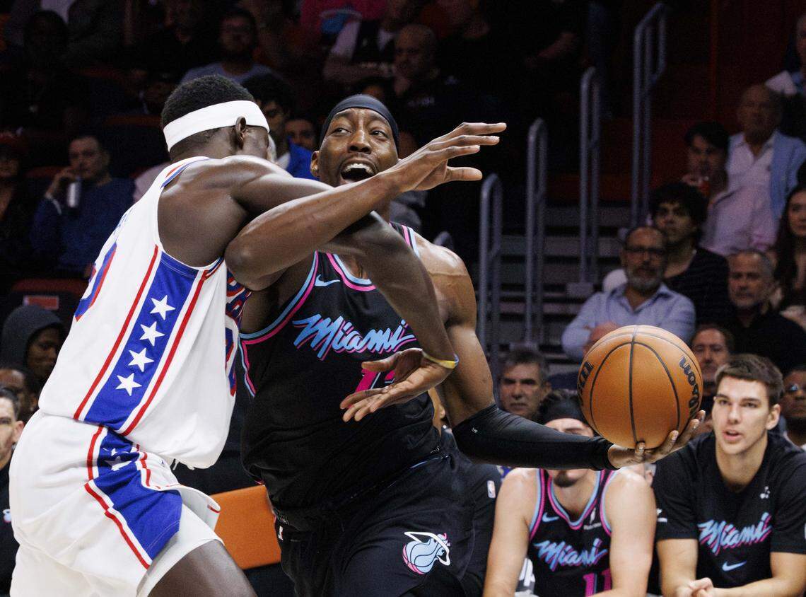 Miami Heat center Bam Adebayo (13) get fouled by Philadelphia 76ers center Adem Bona (30) during the first half of a game on March 30, 2026, at Kaseya Center in Miami.