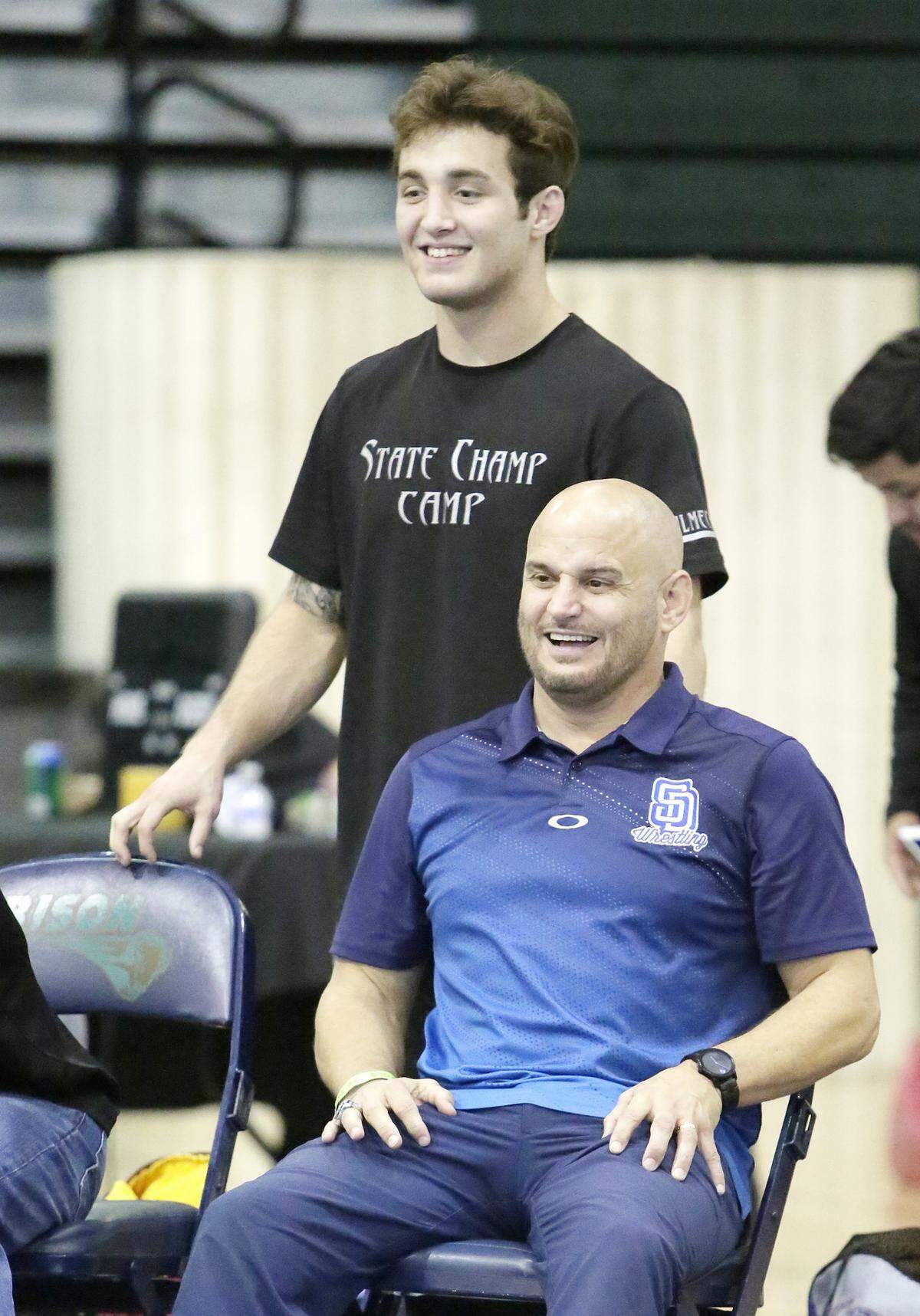 South Dade HS wrestling head coach Vic Balmeceda and his son, 160 lbs class wrestler Brevin during the Region 4-3A HS wrestling finals on March 2, 2019 at Ronald W. Reagan Doral Senior HS in Doral