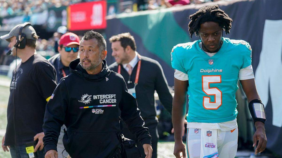 Miami Dolphins quarterback Teddy Bridgewater (5) leaves the field after taking a hit from the New York Jets during the first quarter of an NFL football game, Sunday, Oct. 9, 2022, in East Rutherford, N.J. (AP Photo/Seth Wenig)