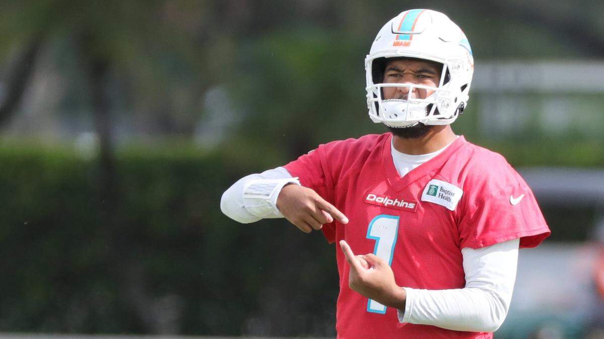 Miami Dolphins quarterback Tua Tagovailoa (1) gestures during practice at Baptist Health Training Complex in Miami Gardens on Thursday, December 30, 2021.