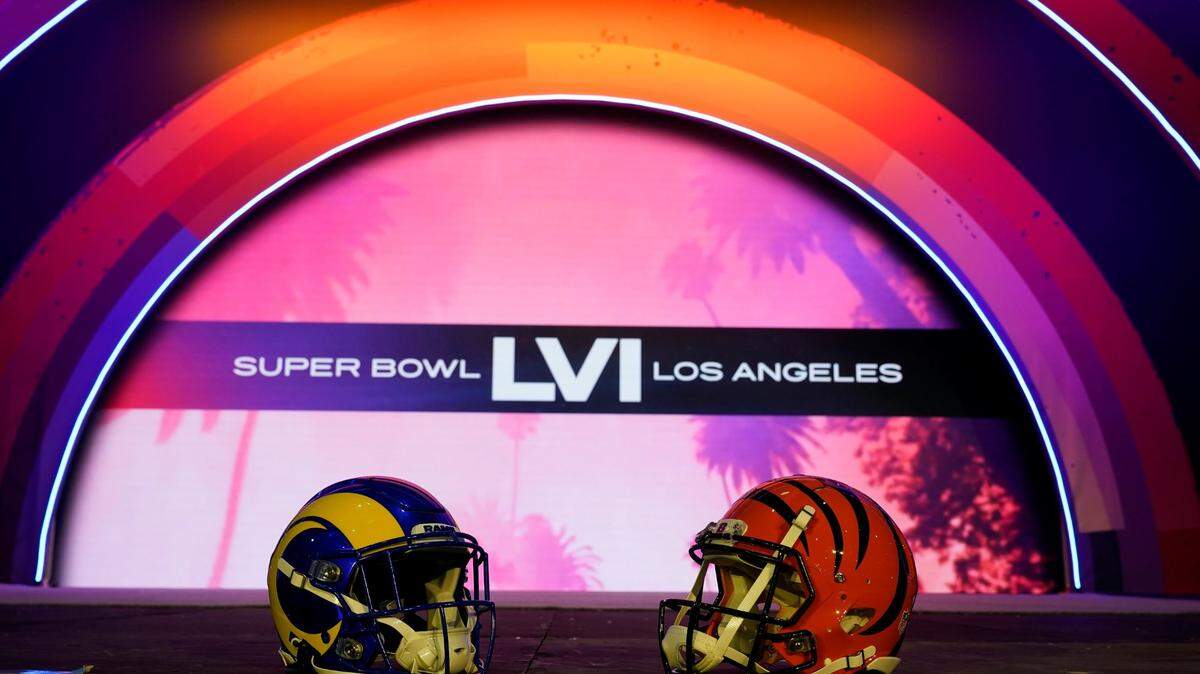 Los Angeles Rams and Cincinnati Bengals helmets sit on a stage inside the NFL Experience, an interactive fan show, Friday, Feb. 4, 2022, at the Los Angeles Convention Center in Los Angeles. The Los Angeles Rams are scheduled to play the Cincinnati Bengals in the Super Bowl NFL football game Jan. 13 in Inglewood, Calif. (AP Photo/Marcio Jose Sanchez)