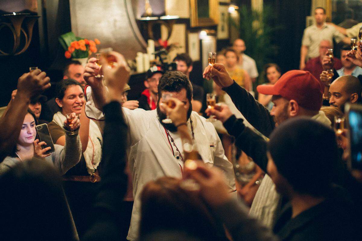 Robby Ramos leads a toast during the performance.