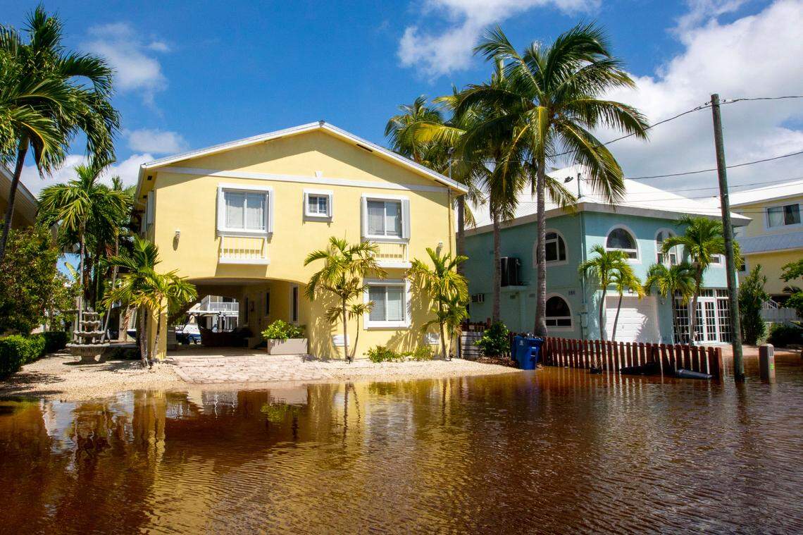 Houses sit just above flood waters off North Blackwater Lane during flooding due to Hurricane Ian at Stillwright Point in Key Largo, Florida, on Thursday, September 29, 2022.