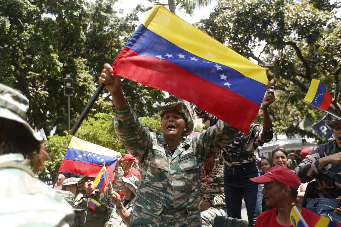 Members of the Bolivarian National Militia participate in military training at Plaza Bolivar in Caracas on Oct. 4, 2025. Venezuelan soldiers carried out communication drills in preparation for a possible armed conflict, in response to what they denounce as a ‘siege’ by the United States.      