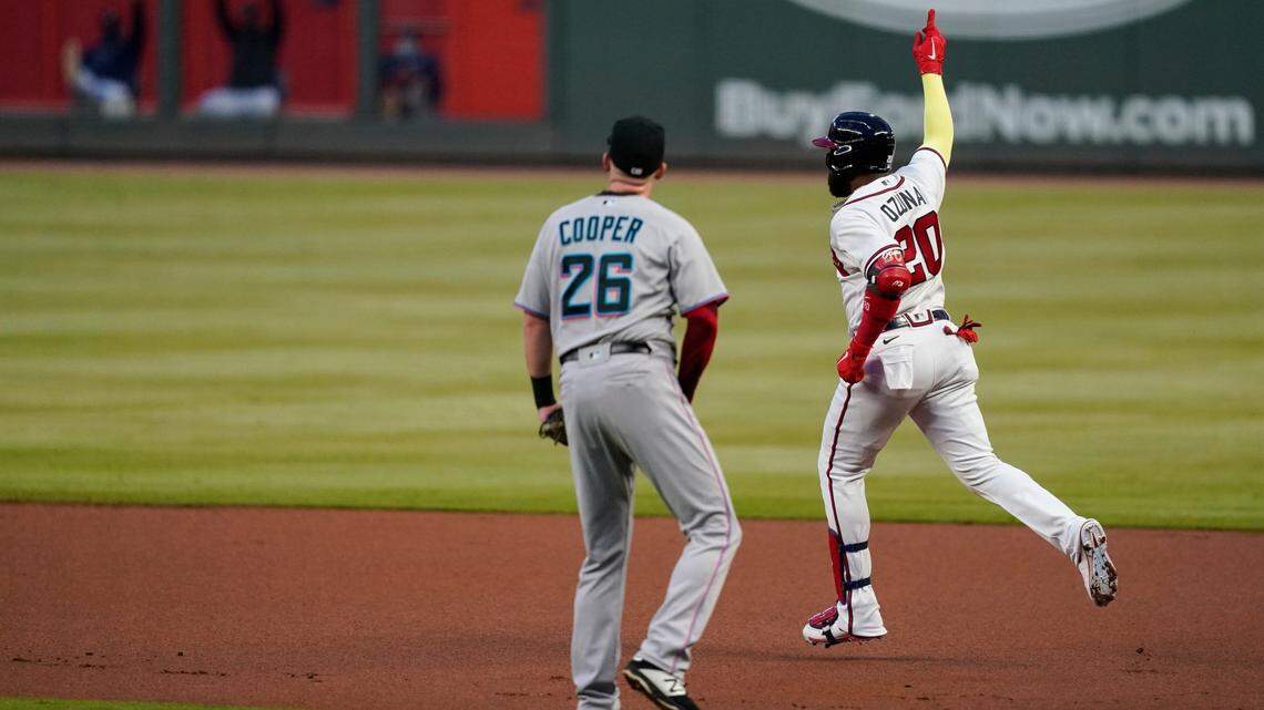 Atlanta Braves’ Marcell Ozuna (20) celebrates after hitting a solo home run during the first inning of the team’s baseball game against the Miami Marlins on Tuesday, Sept. 22, 2020, in Atlanta. (AP Photo/Brynn Anderson)
