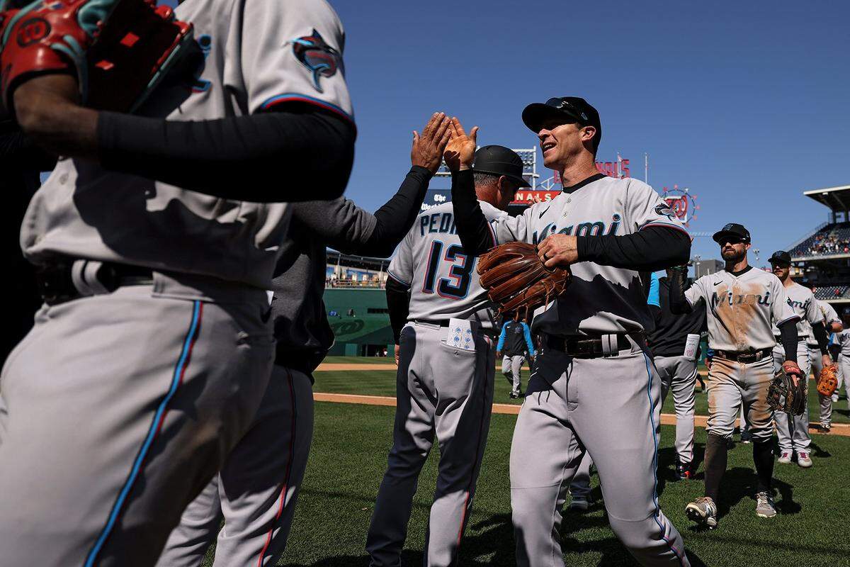 The Miami Marlins celebrate after defeating the Washington Nationals at Nationals Park on April 28, 2022, in Washington, DC. (Patrick Smith/Getty Images/TNS)
