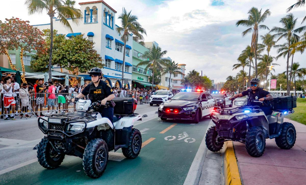 Miami Beach police units rush to a call along Ocean Drive during spring break on Miami Beach, Florida on Saturday, March 16, 2024.