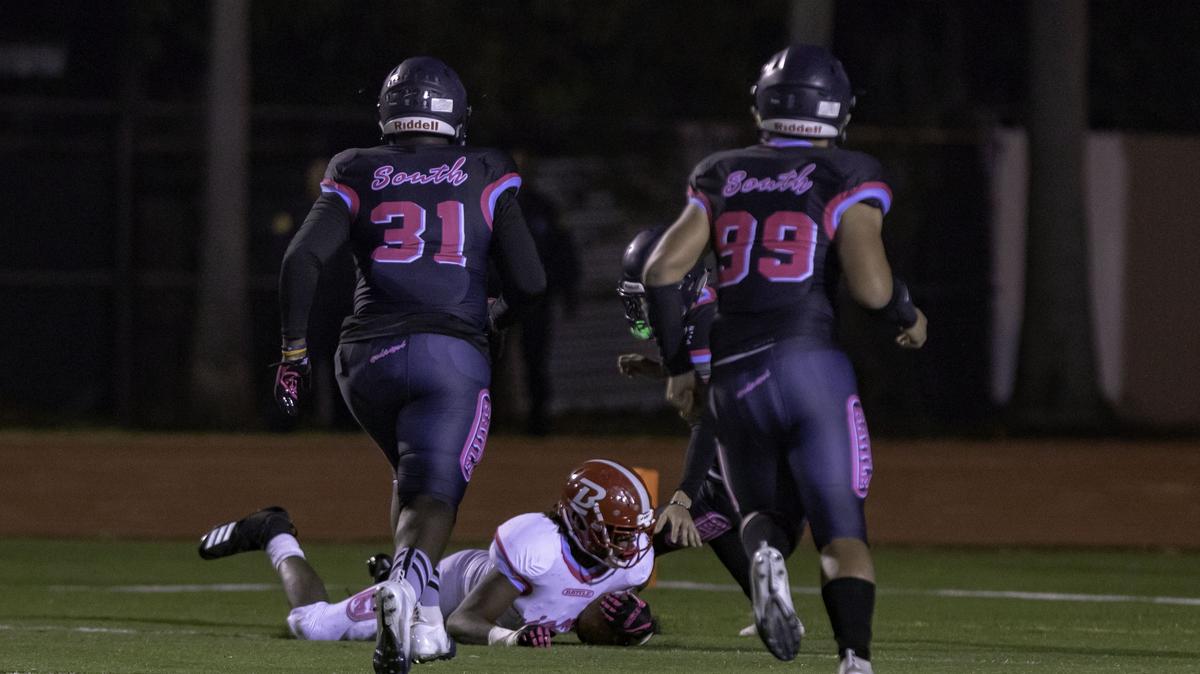 Miami Beach High School defensive end Edgar Harris (35), for the North team, blocks the punt and recovers the ball after the first drive of the Miami-Dade high school football All-Star game at Curtis Park in Miami, FL, on Saturday, December 22, 2018.