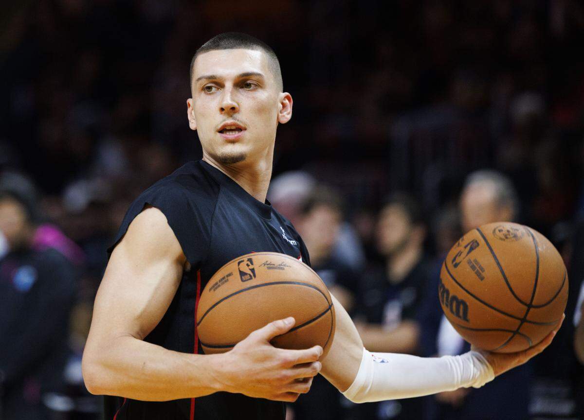 Miami Heat guard Tyler Herro (14) warms up before the first half of a game against the Dallas Mavericks on Nov. 24, 2025, at Kaseya Center in Miami.