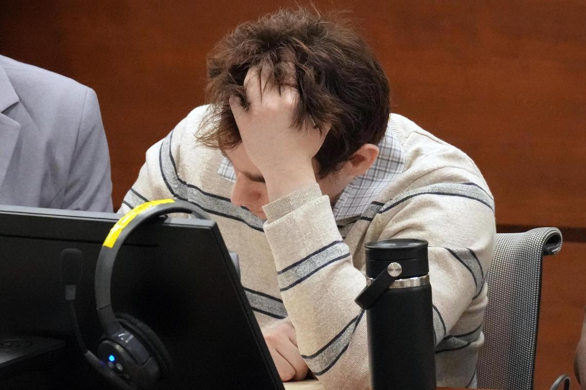 Marjory Stoneman Douglas High School shooter Nikolas Cruz holds his head in his hands during closing arguments in the penalty phase of Cruz’s trial at the Broward County Courthouse in Fort Lauderdale on Tuesday, Oct. 11, 2022.