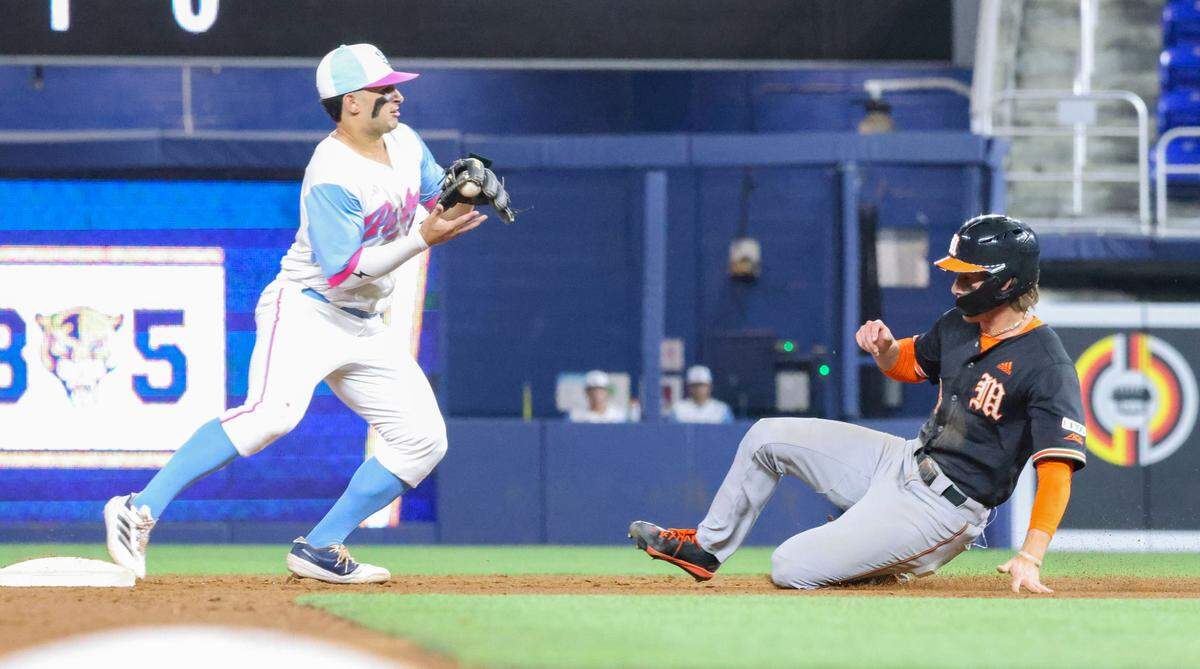 Miami infielder Jake Ogden (4) is out by FIU infielder Alex Ulloa (1) during the second inning of a game on Tuesday, March 4, 2025, at loanDepot Park in Miami, Fla.