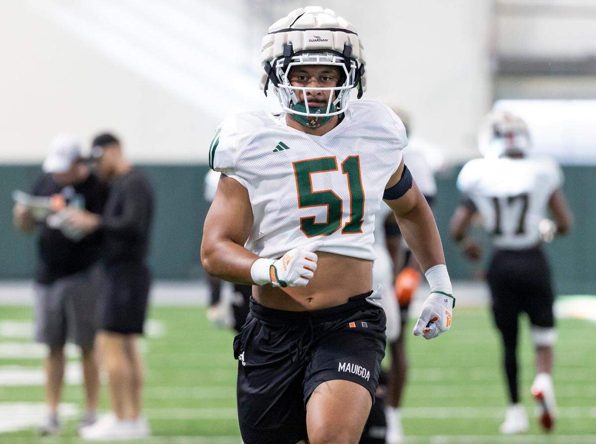 Miami Hurricanes linebacker Francisco Mauigoa (51) warms up during practice at the Carol Soffer Indoor Practice Facility at the University of Miami on Wednesday, August 8, 2023 in Coral Gables, Fla.