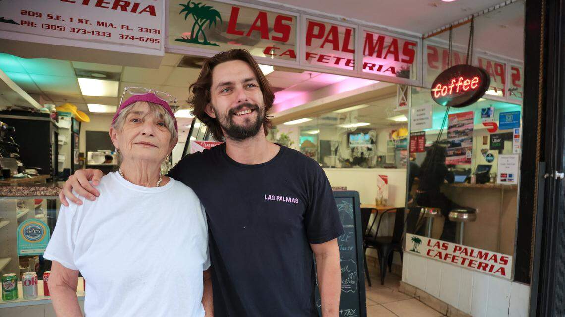 Las Palmas Restaurant owners Carla Luigia Ferrari Magalhaes and her son Mario Magalhaes pose for a photo outside their restaurant at 209 SE First St., in downtown Miami, Florida, on Thursday, Nov. 6, 2025.
