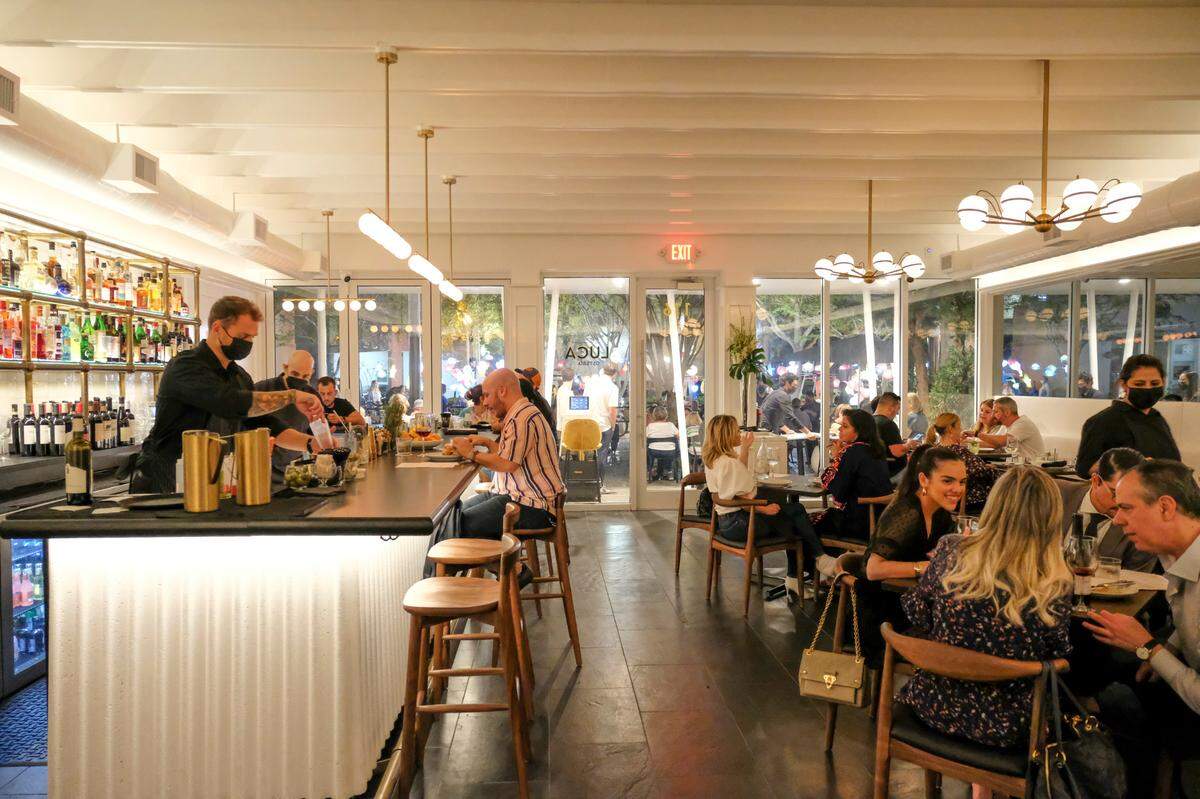 The bar and dining room inside Luca Osteria