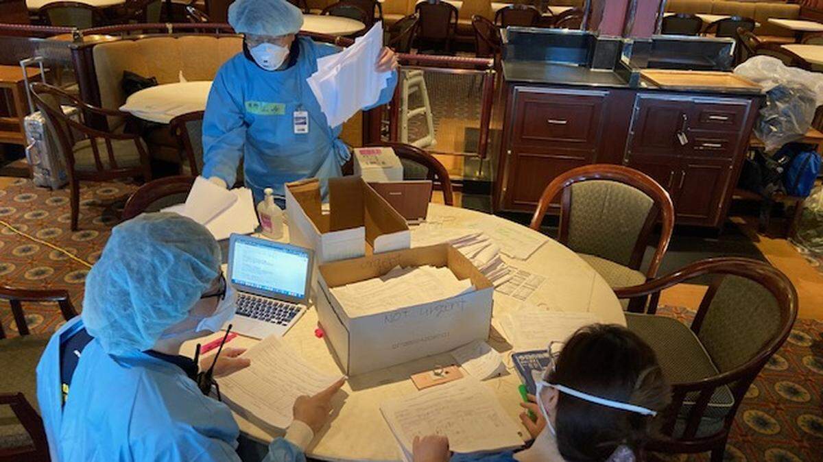 Pharmacists aboard the Diamond Princess cruise ship work to fill prescriptions for passengers during the 14-day quarantine in Yokohama, Japan.