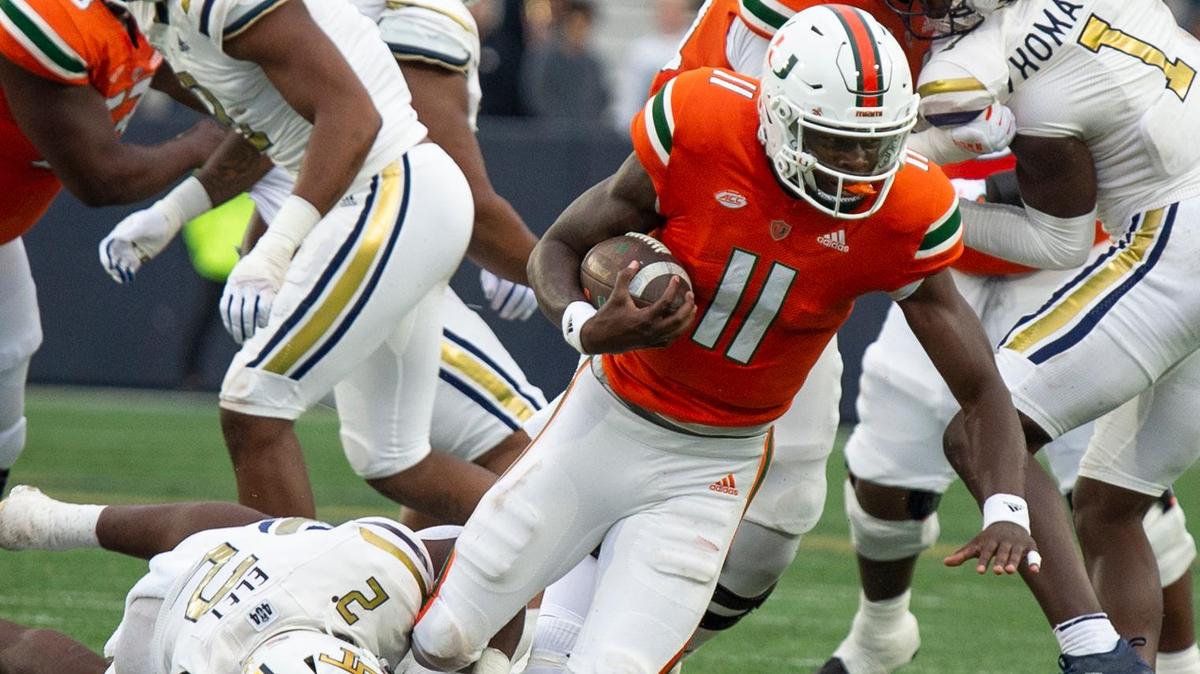 Miami quarterback Jacurri Brown (11) is tackled by Georgia Tech’s linebacker Ayinde Eley (2) in the first half of an NCAA college football game Saturday, Nov. 12, 2022, in Atlanta. (AP Photo/Hakim Wright Sr.)