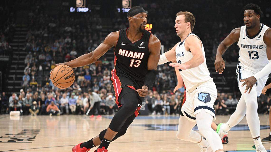 Miami Heat center Bam Adebayo (13) drives against defender Memphis Grizzlies shooting guard Luke Kennard (10) in the first quarter of the game against the Memphis Grizzlies at FedExForum.