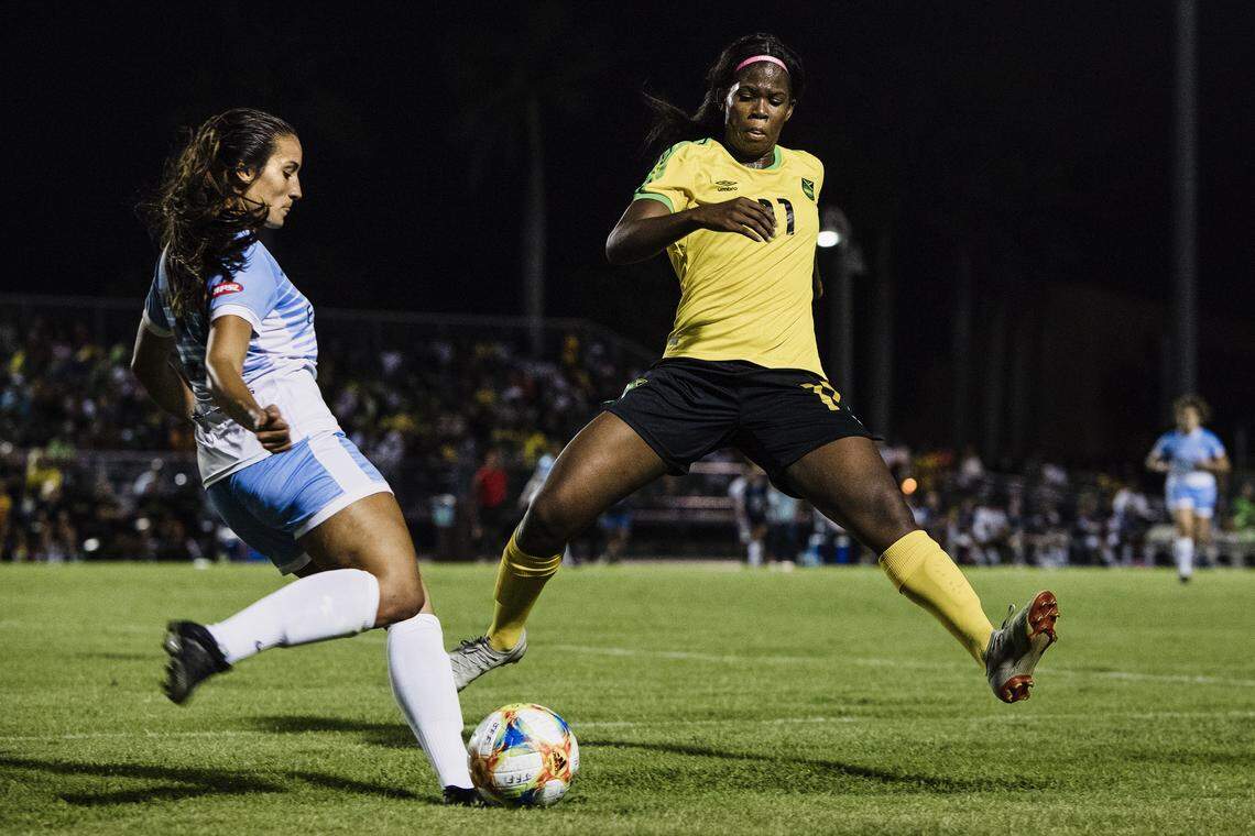 Khadija Shaw, right, known as Bunny, of Jamaica’s national women’s soccer team, the Reggae Girlz, during their exhibition game against FC Surge, in Miramar, Fla., on Thursday, May 23, 2019. Shaw maintained her career despite the deaths of three brothers in gang-related violence in Jamaica.