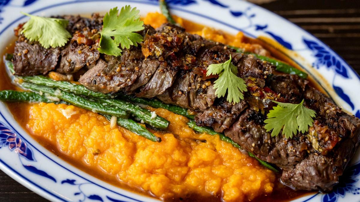 Angus churrasco with mashed sweet potato and truffled green beans at Finka Table & Tap in Miami.