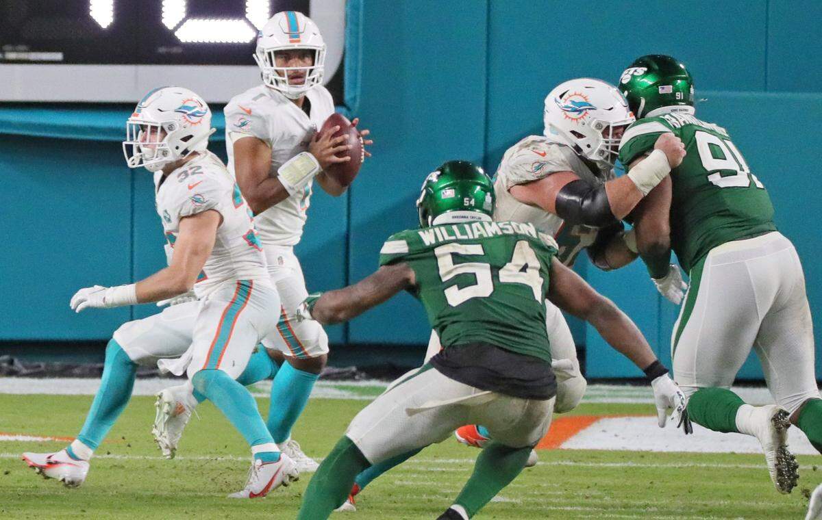 Miami Dolphins quarterback Tua Tagovailoa (1) sets up to pass in the fourth quarter against the New York Jets at Hard Rock Stadium in Miami Gardens on Sunday, October 18, 2020.