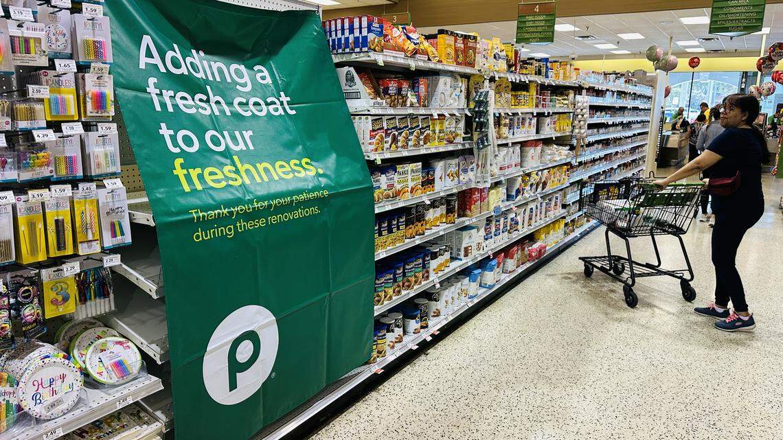 Banners draping some empty shelves inside the Palms at Town & Country mall on Jan. 10, 2026, alert customers that this store is closing on Jan. 17. A new one will be built in its place, Publix says.