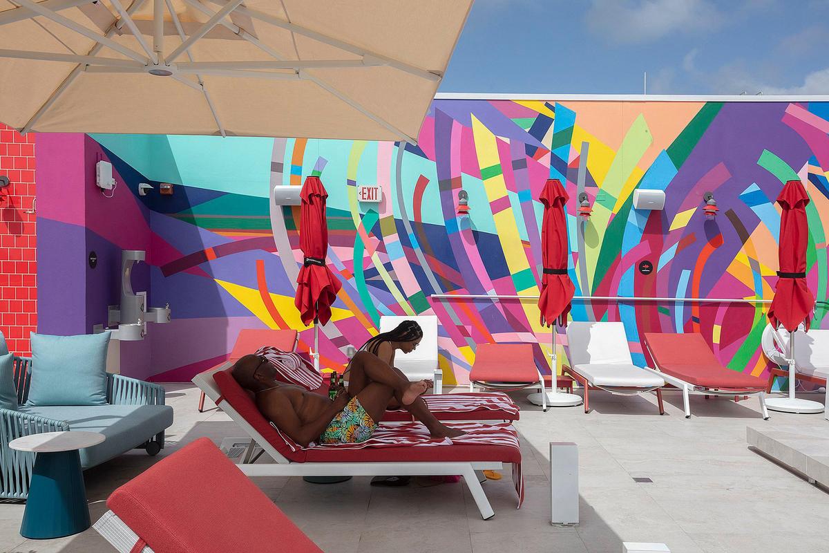 Onward Porunoza and Lorie Scruggs by the pool at citizenM Hotel in Miami Beach; 1200 Lincoln Rd., Miami Beach on Thursday September 5, 2024.