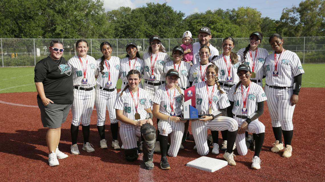 Coral Reef Barracudas pose with the trophy for the picture after winning GMAC softball championship game against Goleman Gators on Friday, April 17, 2026 at JC Bermudez HS in Doral. Andrew Uloza / for Miami Herald