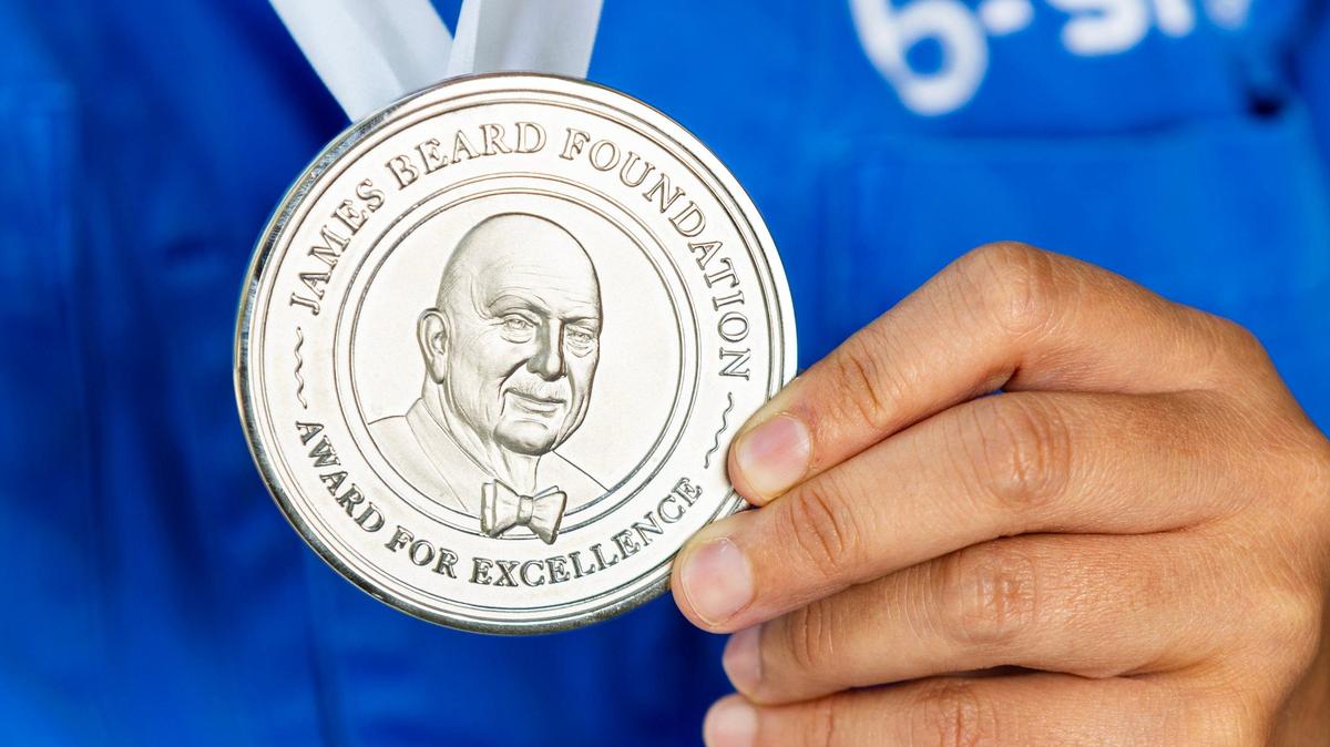 A James Beard Foundation Award medal.