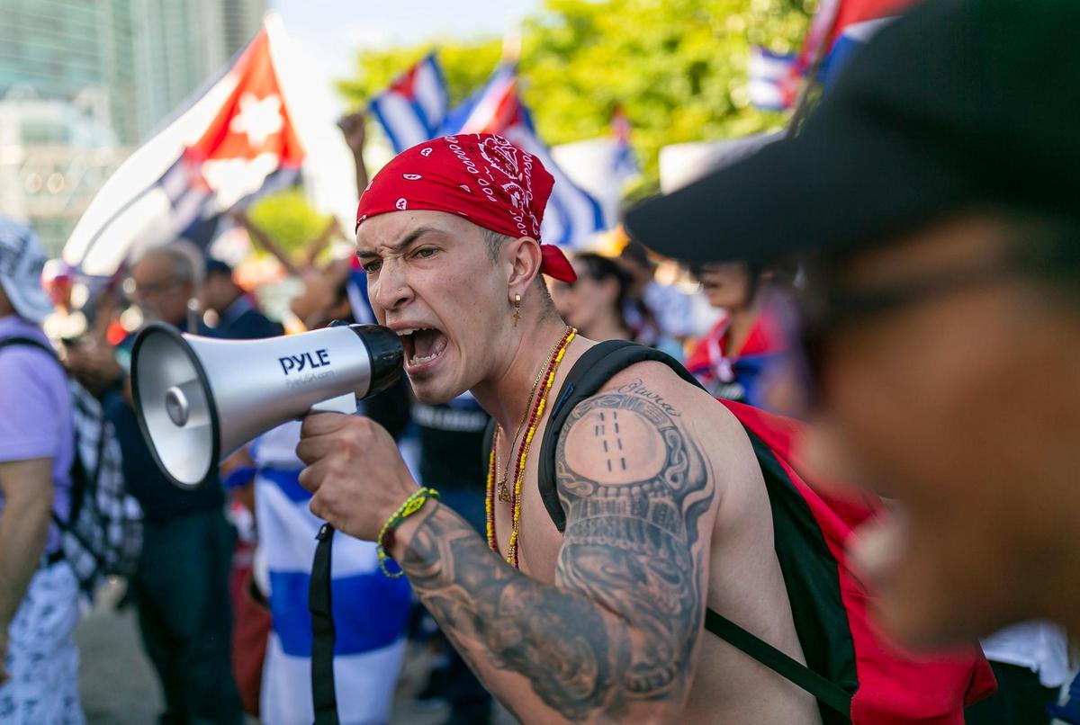 Frank Ogbe, 22, participates in a rally at the Freedom Tower in downtown Miami on Saturday, July 17, 2021. The rally was held in solidarity with the protests happening in Cuba.