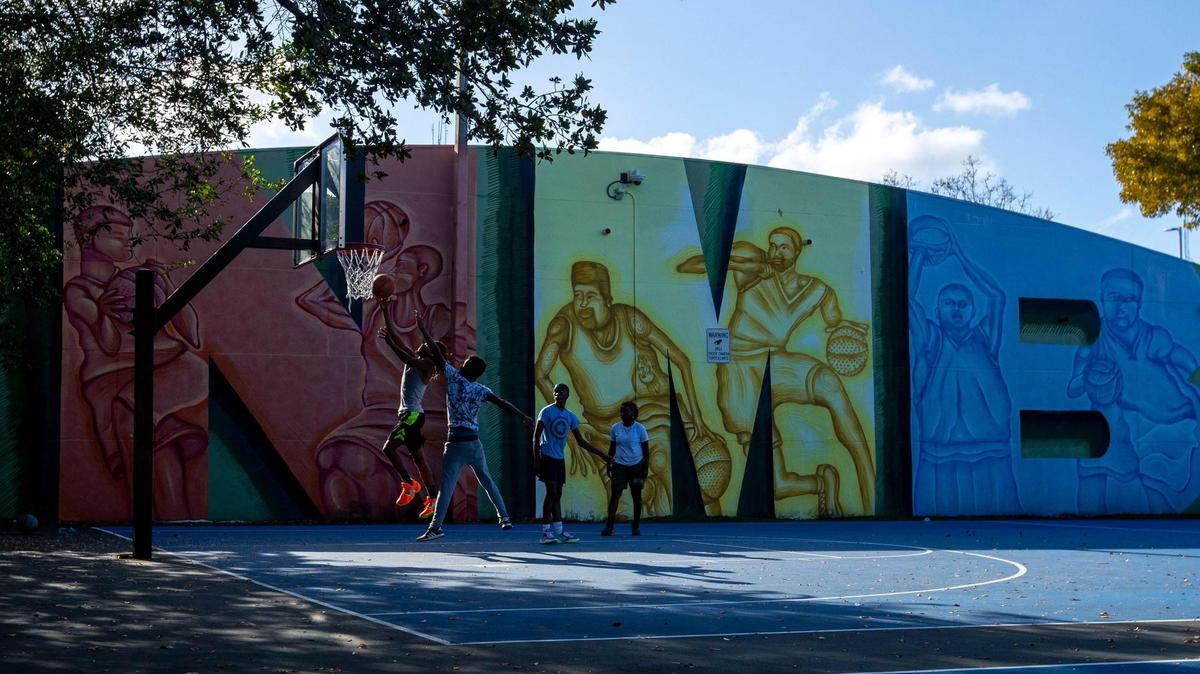 Kids play basketball at Victory Park in North Miami Beach, Florida, on Friday, March 18, 2022. North Miami Beach has the cheapest rents in Miami-Dade County with median rents as low as $1,250 per month in some areas.