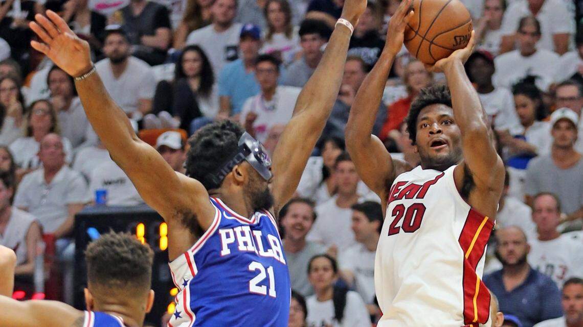 Heat forward Justise Winslow shoots over Sixers center Joel Embiid in the first half of Game 3 of a first round playoff series at AmericanAirlines Arena.