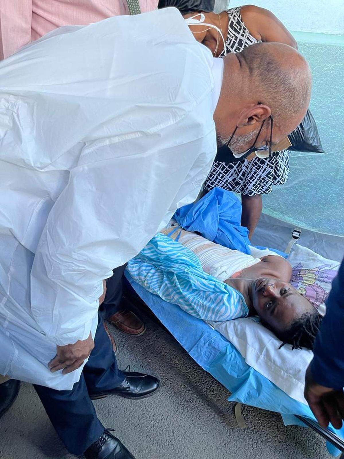 Haitian Prime Minister Ariel Henry, who is also a doctor, toured Justinien University Hospital on Tuesday, December 14, 2021 to visit victims of a gas tanker explosion in Cap-Haitien. Bandaged victims crowded the floor of the hospital as doctors and nurses faced a shortage of supplies,