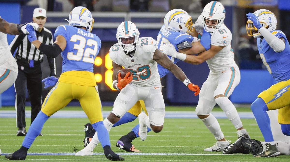 Miami Dolphins running back Jeff Wilson Jr. (23) carries the ball in the second quarter during the game against the Los Angeles Chargers at SoFi Stadium in Inglewood, California on Sunday, December 11, 2022.