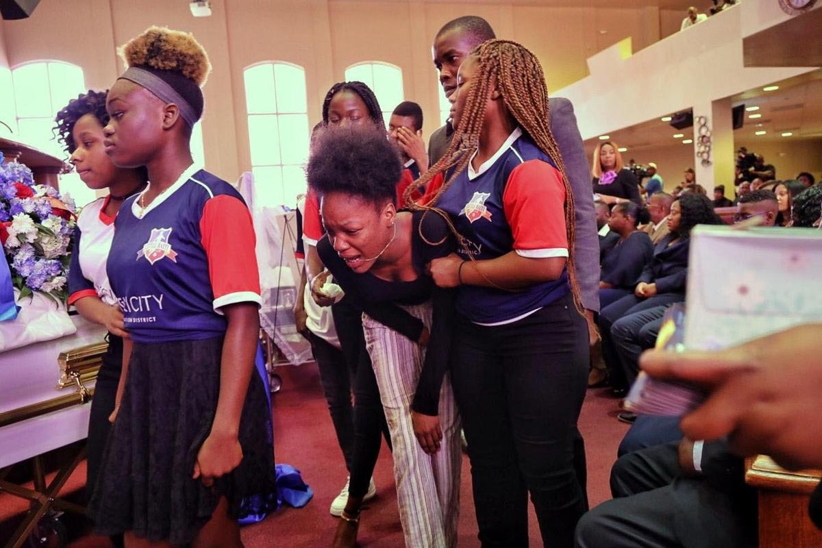 Mourners pay their respect to the three Haitian teens killed by a motorist during the memorial service at 93rd Community Baptist Church on Saturday, June 22, 2019.