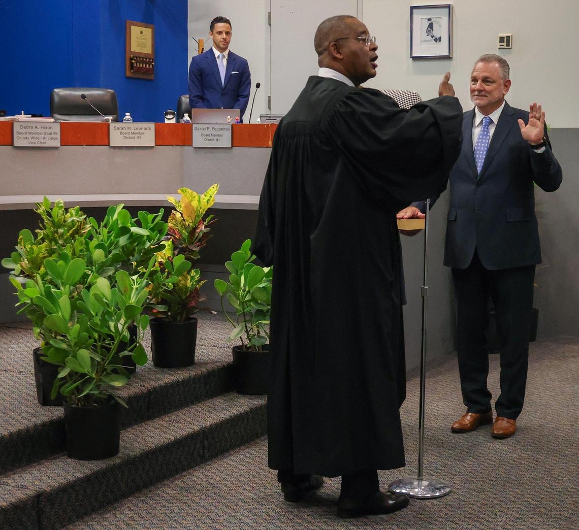 Broward Circuit Judge Elijah H. Williams, center, gives closing remarks during the swearing in of Peter B. Licata, right, as the superintendent of Broward County Public Schools at the Kathleen C. Wright Administration Center’s boardroom in Fort Lauderdale, Florida on Tuesday, July 18, 2023.